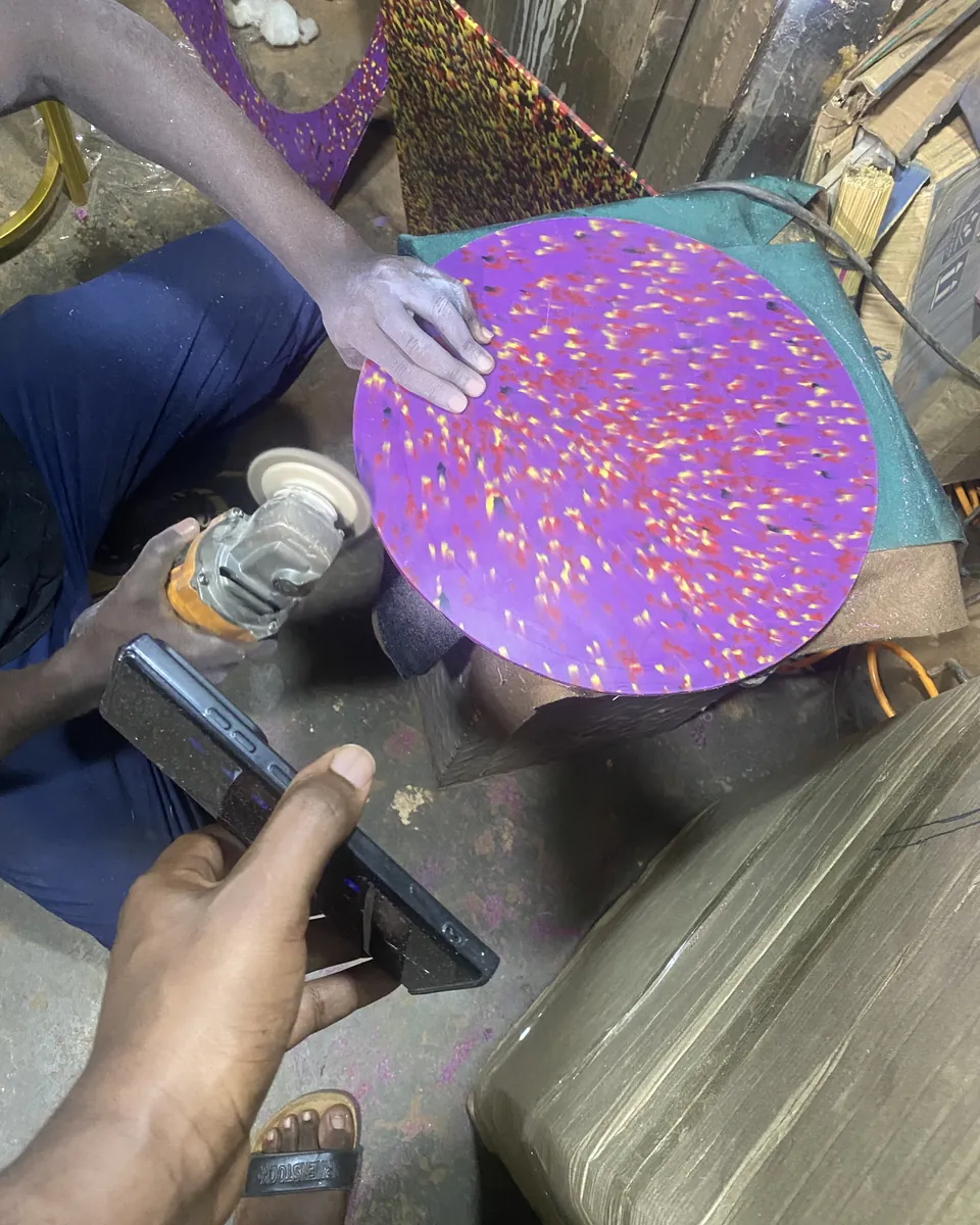 Sanding the edge of a recycled plastic stool top